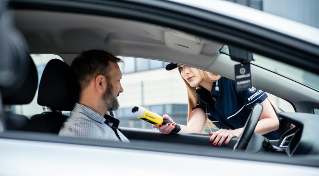 A photo of a safe driver receiving a discount on their insurance policy. — car insurance discounts Nevada