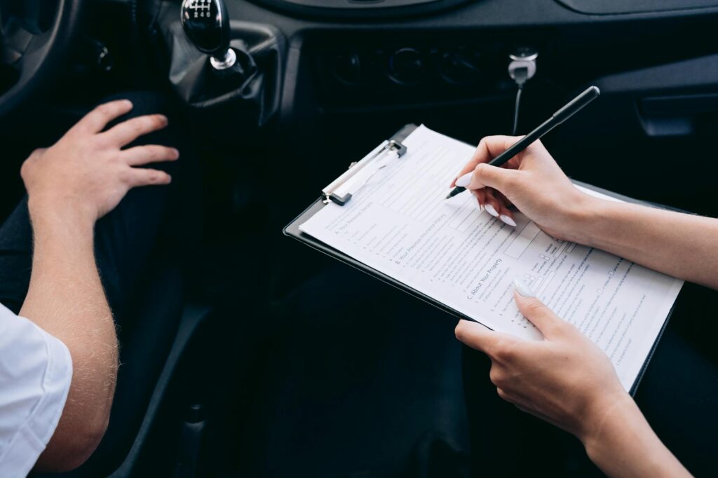 An image of a driver looking at their insurance policy, symbolizing the importance of a clean driving record related to driving record car insurance Nevada.