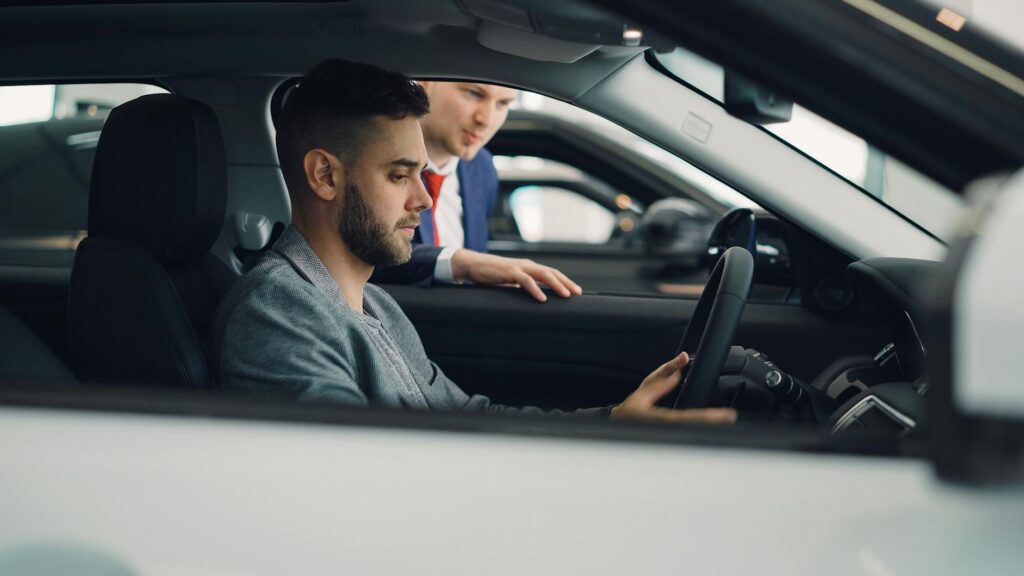 An image of a person inspecting a rental car for damages before driving off. — choosing rental car insurance Nevada