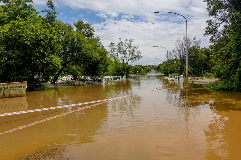 Photo of a flooded road in Nevada illustrating extreme weather events. — Nevada weather car insurance rates