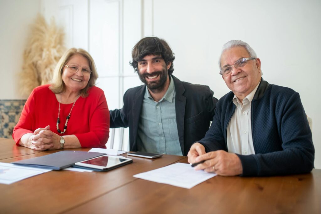 A family happily discussing their insurance options at home. — bundling insurance Nevada