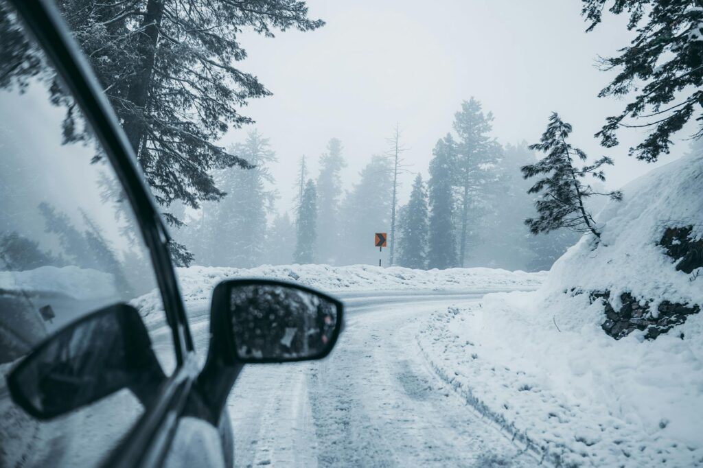A photo of a snow-covered road in Nevada, illustrating winter driving conditions. — Nevada weather car insurance rates