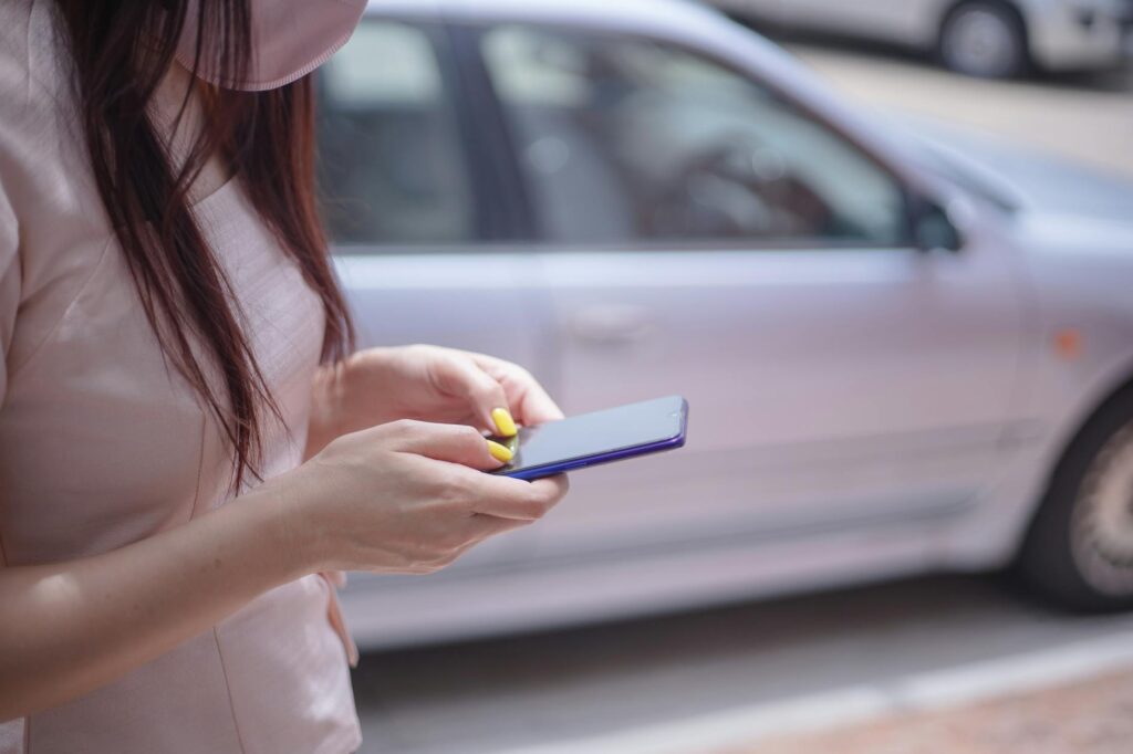 An image of a person using a mobile device to compare car insurance rates — compare car insurance rates Nevada