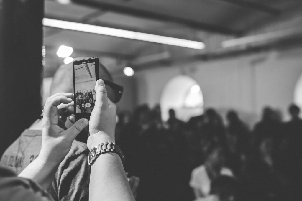 Image showing a person documenting an accident scene with a smartphone. — after car accident Nevada
