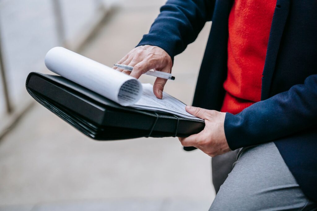 A photo of a person organizing their claim documents. — file car insurance claim Nevada