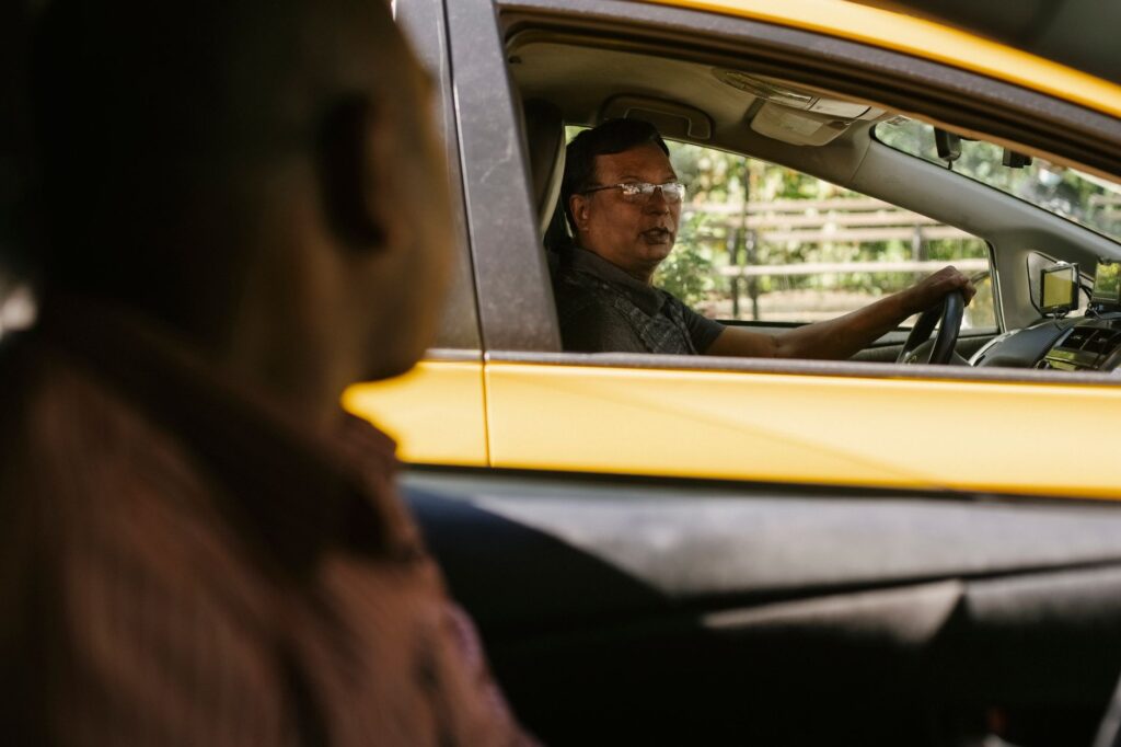 A close-up photo of a driver exchanging information with another driver after car accident Nevada.