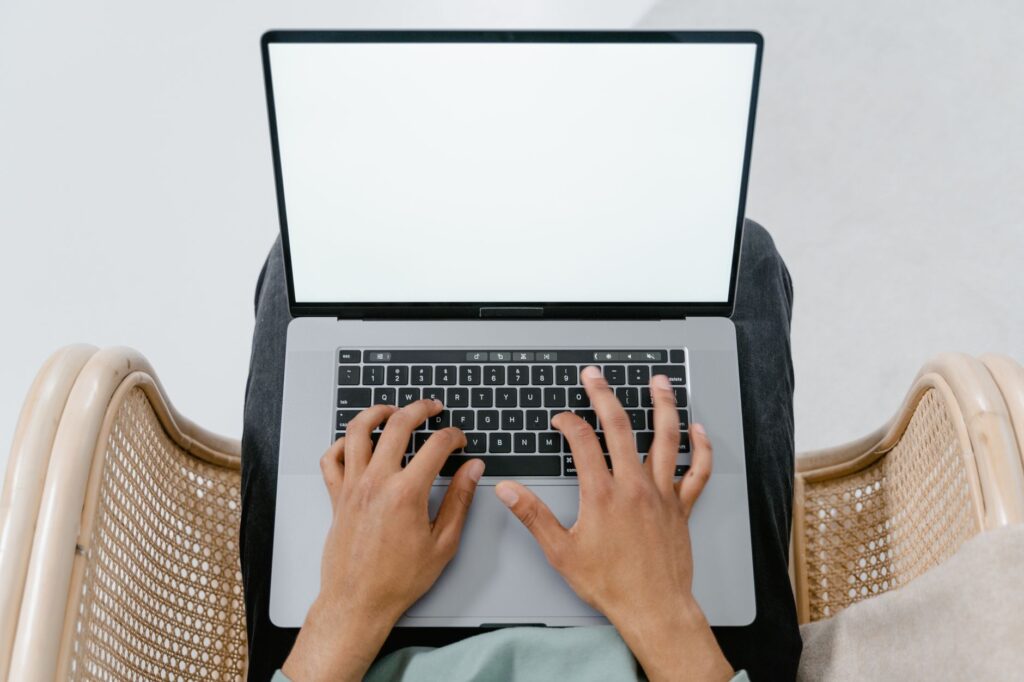 A person using a laptop to compare car insurance online. — cheap car insurance Nevada