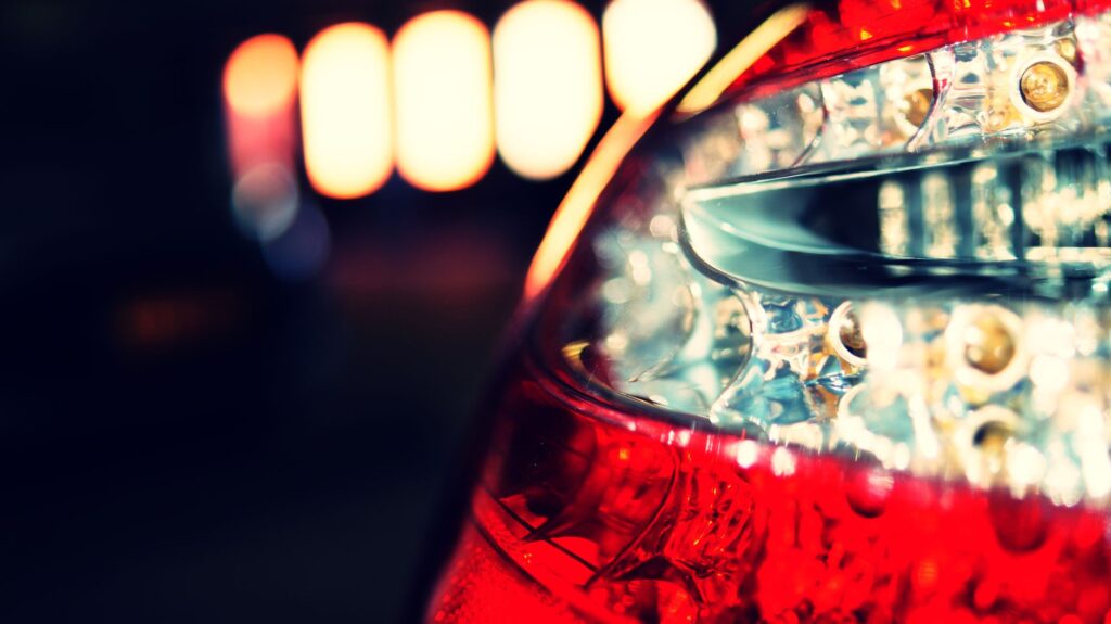 An image of a car with safety features highlighted for discounts — lower car insurance premiums Nevada