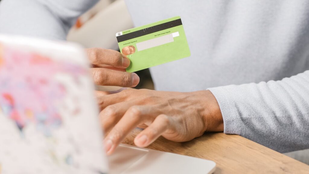 An image of a person checking their credit score online. — credit score impact on car insurance Nevada