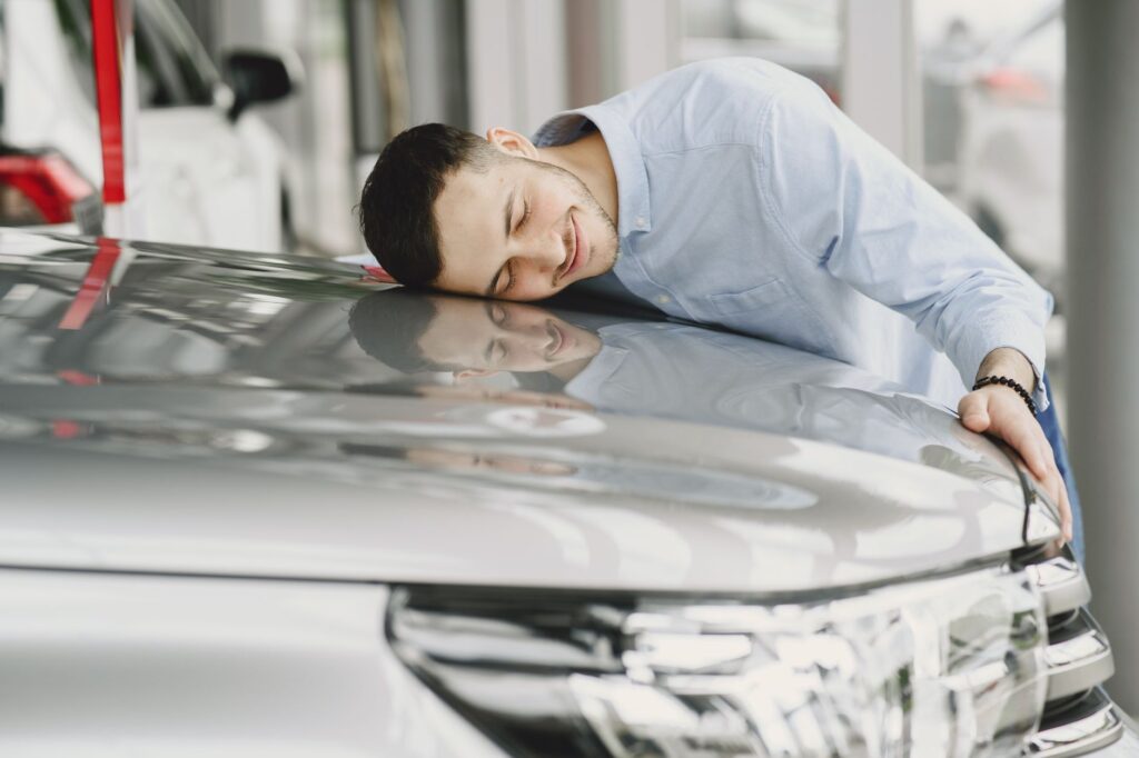 An image of happy car owners maintaining continuous coverage — insurance lapse nevada