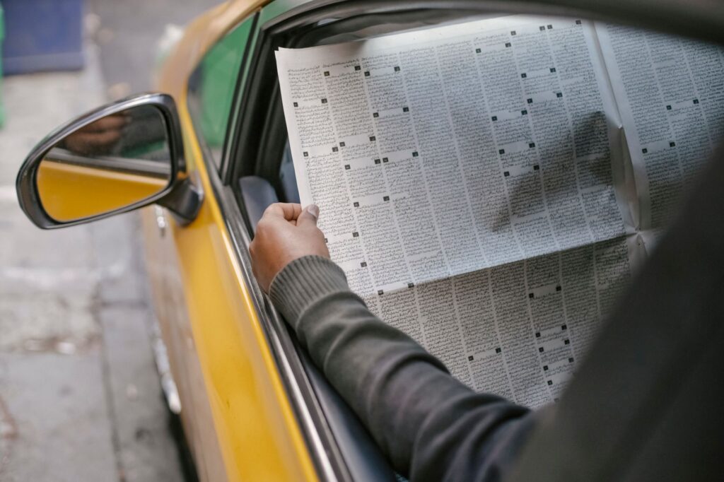 Image of a person gathering information from another driver, illustrating car accident steps Nevada
