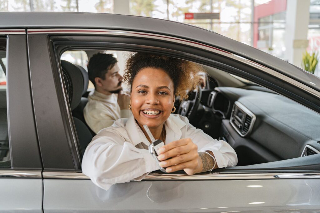 Image showing a young driver with their car, symbolizing new driver insurance — car insurance new drivers Nevada