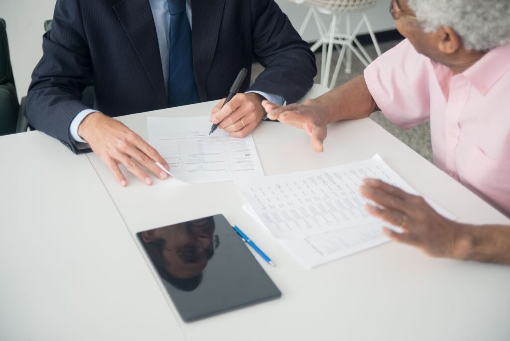 A depiction of a person talking to their insurance agent after an accident. — after car accident Nevada insurance