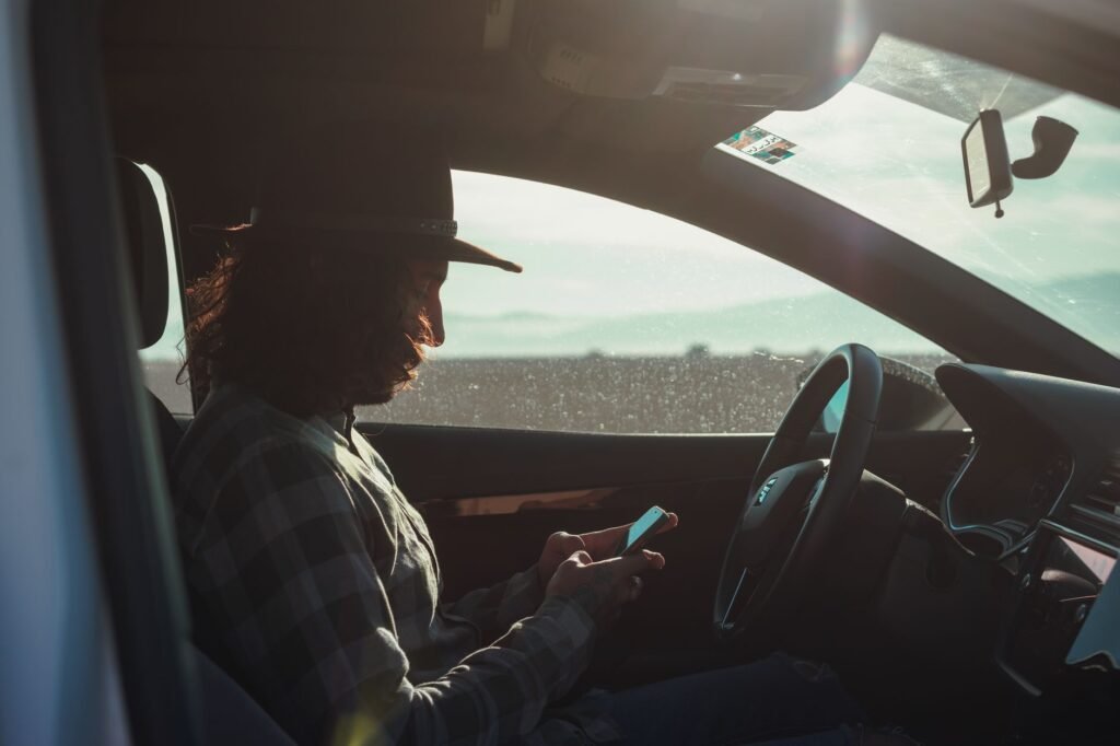 A graphic illustrating telematics technology used in usage-based car insurance Nevada.