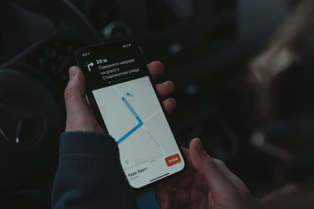 A photo of a driver using a mobile app to track driving habits for insurance savings. — save on car insurance Nevada