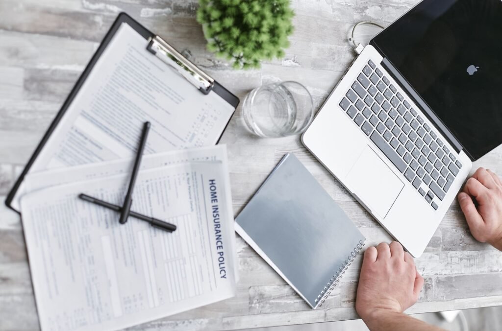 A photo of a person reviewing insurance quotes on a laptop — compare car insurance quotes Nevada