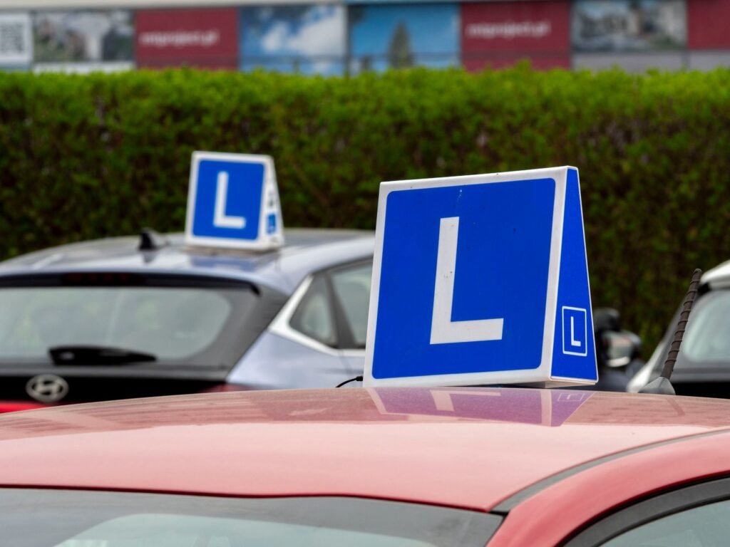An image of a Nevada road sign alongside a new driver's car. — Nevada car insurance teen drivers