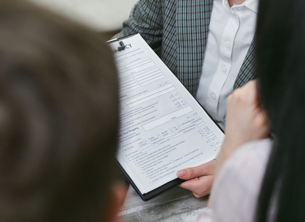 An image of a happy family reviewing their insurance policy together. — save money car insurance Nevada