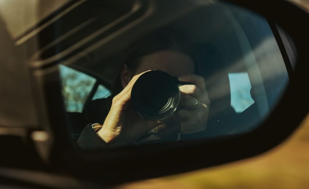 An image of a person documenting the accident scene with a camera. — car accident steps Nevada
