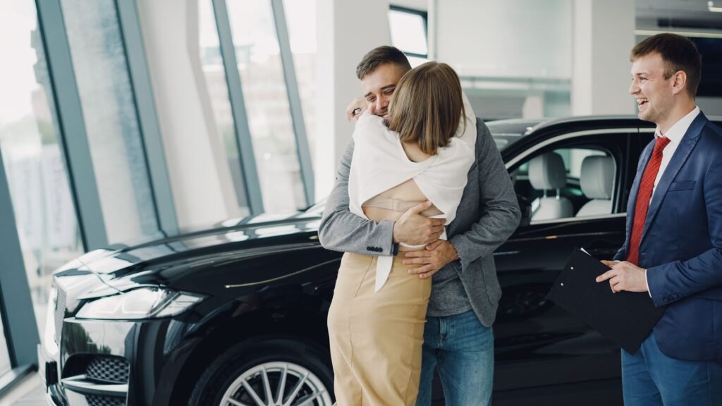 A photo of a happy family with their car, representing good drivers. — affordable car insurance Nevada