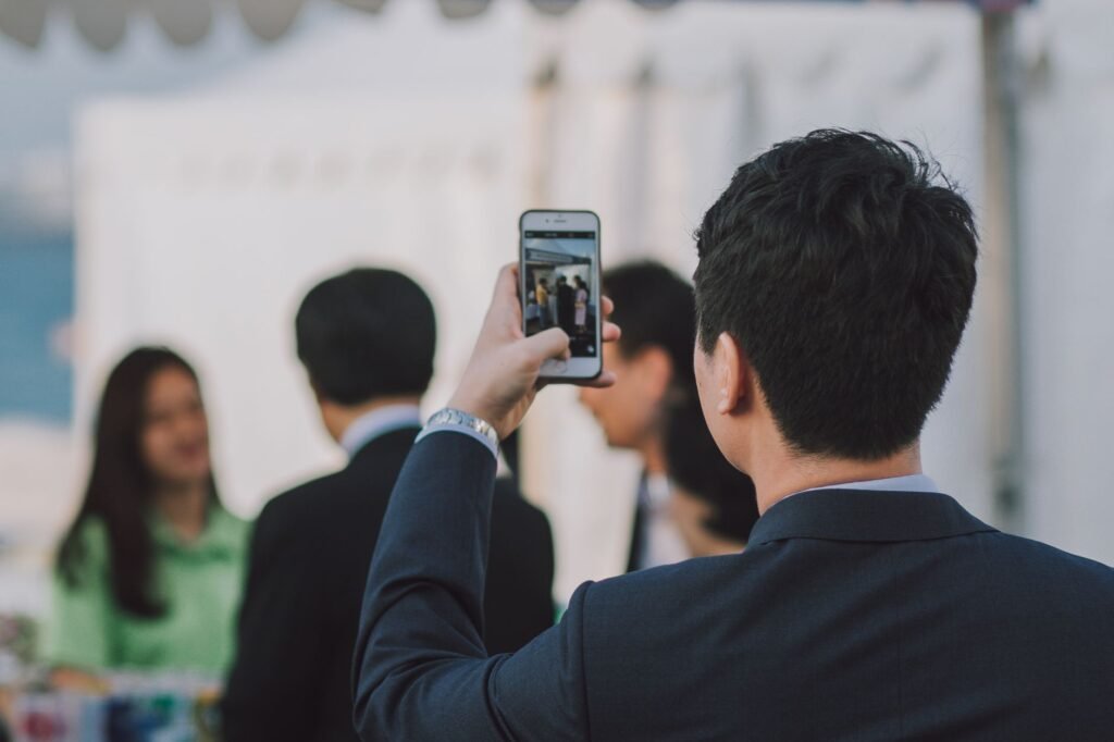 An image of a person documenting an accident scene with their smartphone. — car accident insurance Nevada