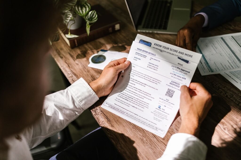 An image of a person reviewing their credit report. — credit scores car insurance Nevada