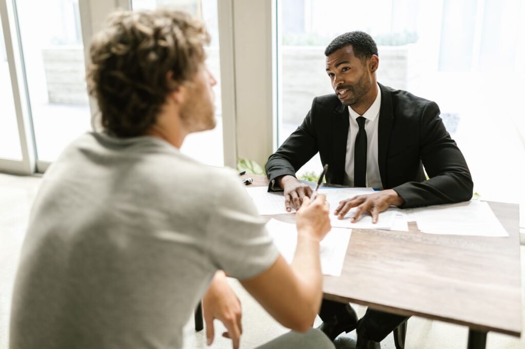 Photo of an insurance agent discussing options with a client about full coverage car insurance Nevada.