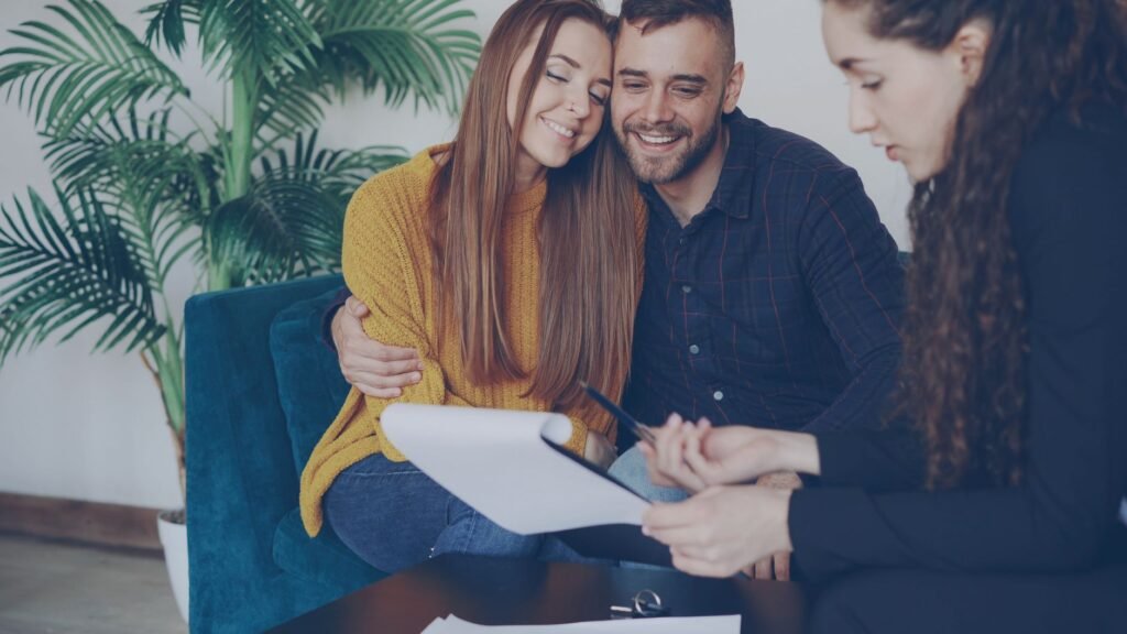 A happy family reviewing their insurance options together. — bundling insurance Nevada