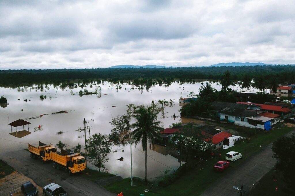 An image depicting flood damage to a vehicle with a caption on insurance implications. — Nevada weather car insurance cl…