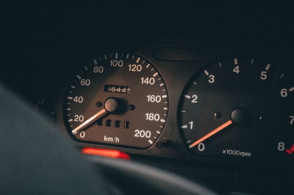 image of a car with a low mileage odometer reading, illustrating low mileage discounts — Nevada car insurance discounts